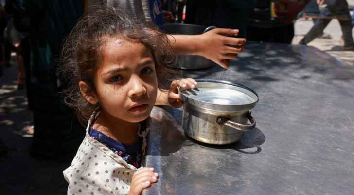 A displaced Palestinian child lines up to receive food in Rafah, south Gaza. (April 19, 2024) (Photo: Mohammed Abed/ AFP) 