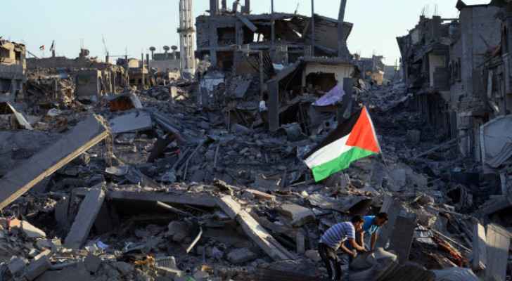 Palestine's flag in the middle of Gaza's rubble after Israeli Occupation strike (Credit: AFP)