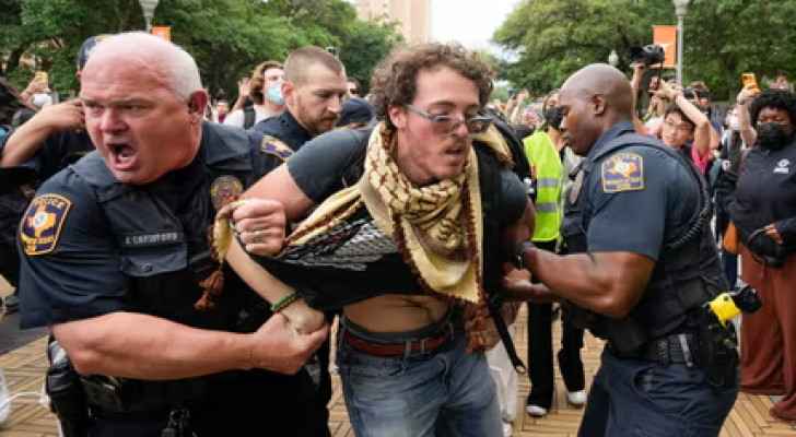 Police at University of Texas in Austin detain an individual during a pro-Palestinian demonstration on campus. (Photo: Jay Janner/AP)