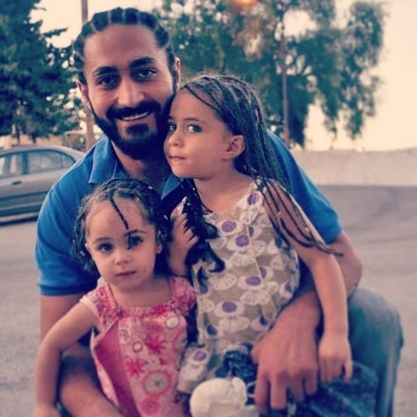 Waseem Alsati, with his daughters, including Alin (left).