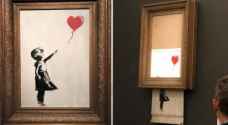 Banksy auctions self-destruct painting to highest bidder