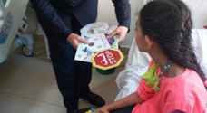 Traffic officers visit girl at Princess Rahma hospital