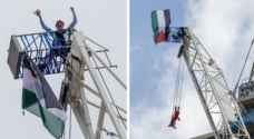 Elderly British man scales 200m crane to raise Palestinian flag in London