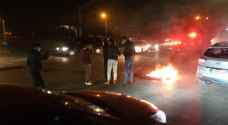 Young individuals burn tires following riots in Irbid