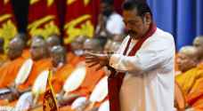 Sri Lanka's ex-PM will not flee country after deadly clashes: son