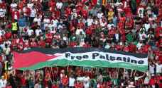 Tunisia fans raise 'Free Palestine' banner during ....