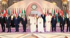 Assad shakes hands with Qatar Emir before Arab summit