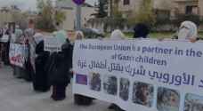 Women protest outside European Union headquarters in Amman