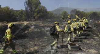 Spain fights fierce fire fanned by winds