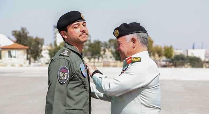 King presents Crown Prince with wings upon completing pilot training