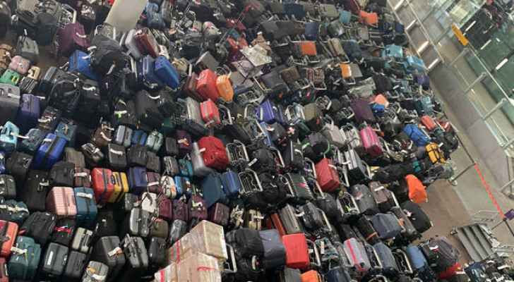 Heathrow Airport apologizes after technical glitch caused mass of suitcases to pile up at Terminal 2