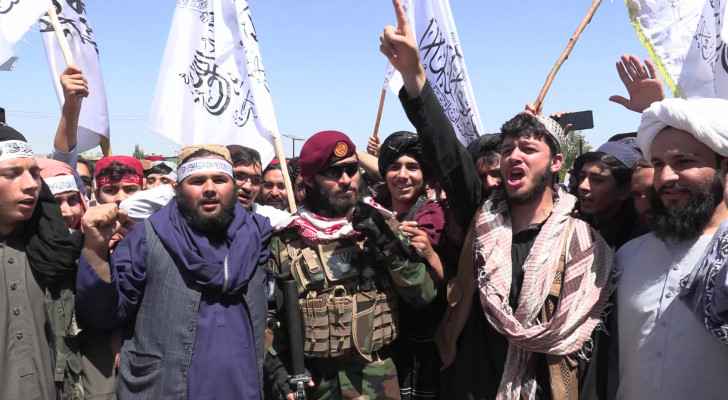Taliban mark anniversary of foreign troop exit with chants, military parade