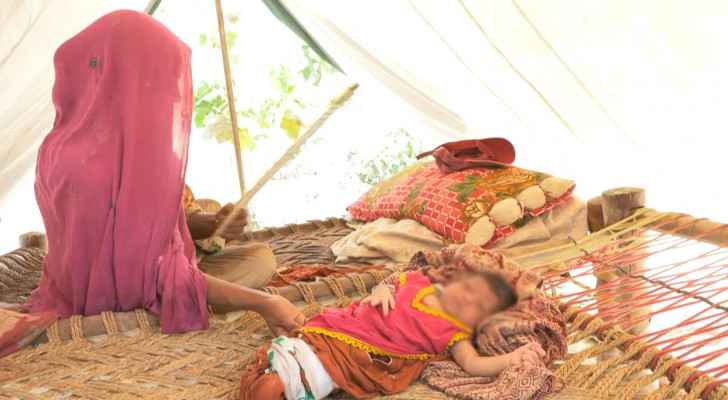 Flood-born: Nothing but mud as mother, infant return to Pakistan home