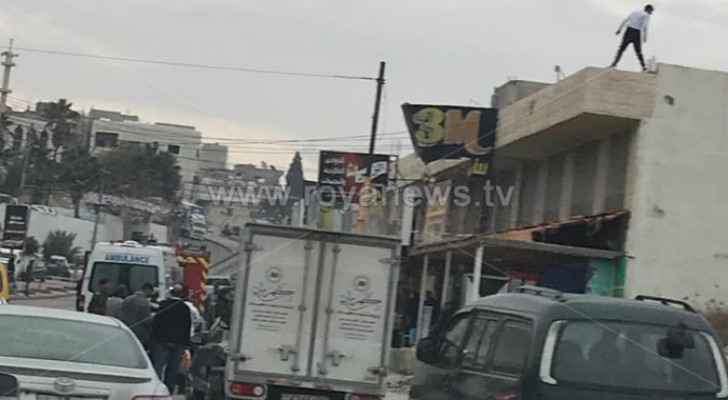 Police stop young man from jumping off building in Irbid