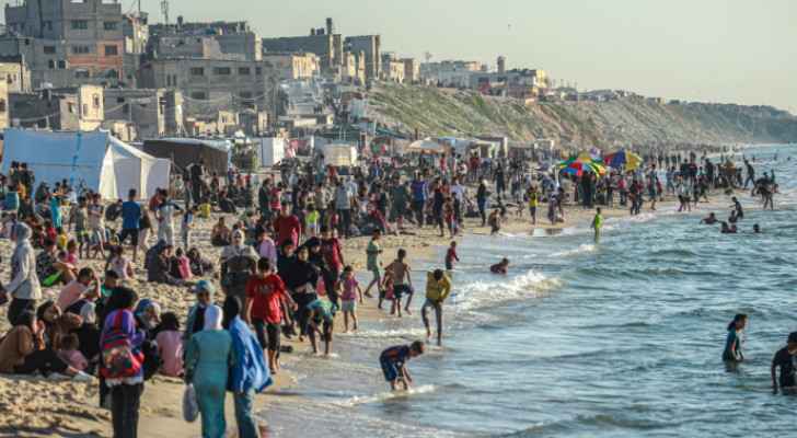 Gazans on the beach of Deir al-Balah. (Credit: AFP)