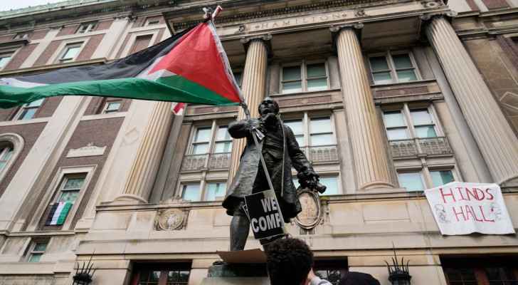 A Palestinian flag paraded outside the entrance to Hamilton Hall on the campus of Columbia University (April 30, 2024) (Photo: AFP)