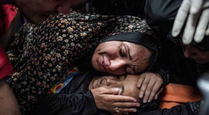 Palestinian mother saying goodbye to her martyred child in Gaza. 